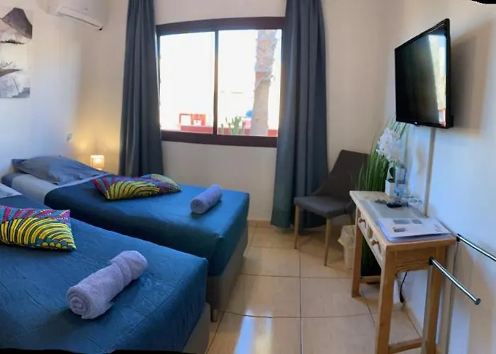 Bedroom With Shared Bathroom And Swimming Pool