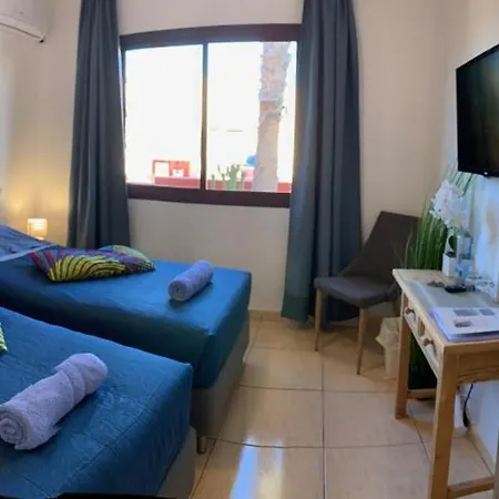 Bedroom With Shared Bathroom And Swimming Pool